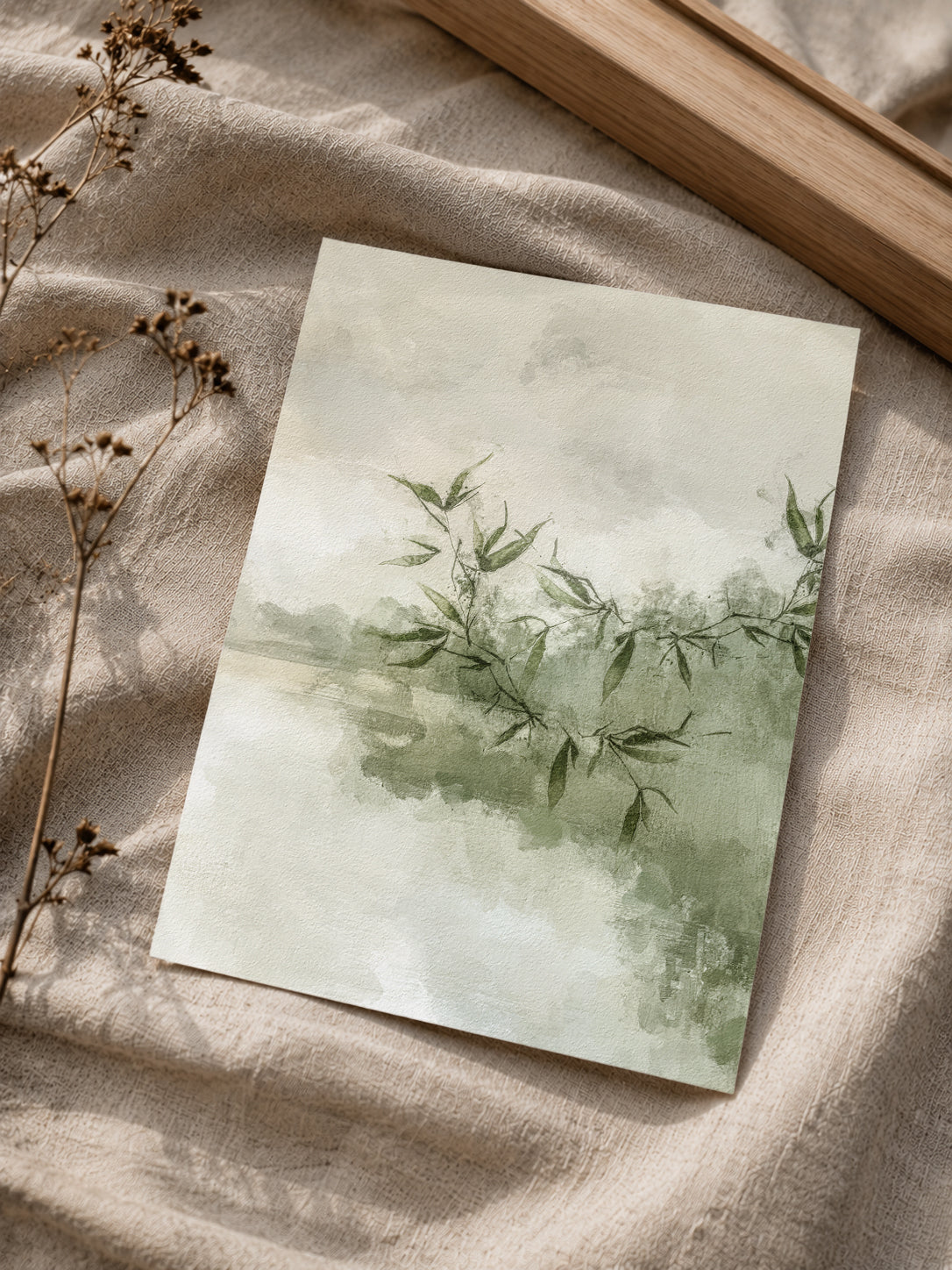 Set of two olive green nature-inspired wall art prints in a bedroom