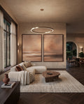 Terracotta wall art set above a sofa in a living room