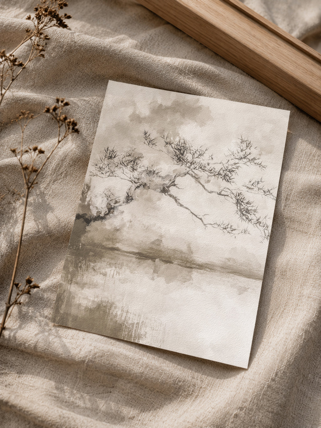 Set of two tree wall art prints above a sofa
